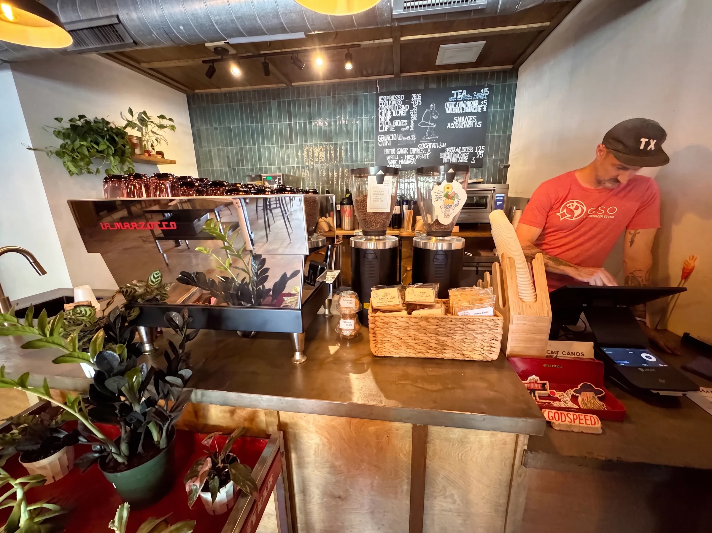 Richie working behind the espresso bar at Moon Wolf Provisions in Richardson, Texas